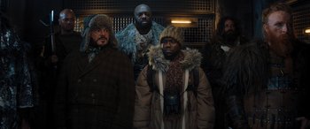 Movie still from “Jumanji: The Next Level” (2019), directed by Jake Kasdan – A group of men standing next to each other; Medium shot, Low angle