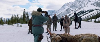 Movie still from “Jumanji: The Next Level” (2019), directed by Jake Kasdan – A group of people in winter clothing standing in the snow; Wide shot, Over the shoulder angle