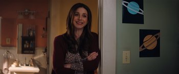 Movie still from “Jumanji: The Next Level” (2019), directed by Jake Kasdan – A woman standing next to a wall with her arms crossed; Medium shot, Over the shoulder angle