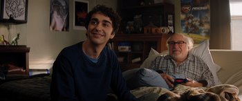 Movie still from “Jumanji: The Next Level” (2019), directed by Jake Kasdan – A young man and an older man sitting on a bed; Medium shot, Over the shoulder angle