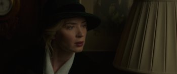 Movie still from “Jungle Cruise” (2021), directed by Jaume Collet-Serra – A woman wearing a black hat looking into a mirror; Close Up shot, Low angle