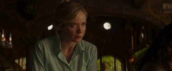 Movie still from “Jungle Cruise” (2021), directed by Jaume Collet-Serra – A woman with blonde hair wearing a green shirt; Close Up shot, Over the shoulder angle