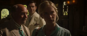 Movie still from “Jungle Cruise” (2021), directed by Jaume Collet-Serra – A woman standing in front of two other men; Close Up shot, Over the shoulder angle