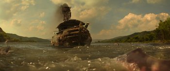 Movie still from “Jungle Cruise” (2021), directed by Jaume Collet-Serra – An old tug boat in a body of water; Extreme Wide shot, Low angle