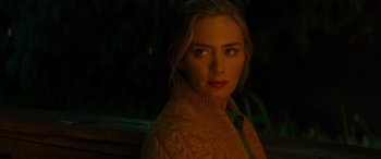 Movie still from “Jungle Cruise” (2021), directed by Jaume Collet-Serra – A woman in a yellow sweater is looking at the camera; Close Up shot, Over the shoulder angle