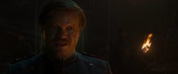 Movie still from “Jungle Cruise” (2021), directed by Jaume Collet-Serra – A person wearing a uniform; Close Up shot, Over the shoulder angle