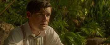 Movie still from “Jungle Cruise” (2021), directed by Jaume Collet-Serra – A man in a white dress shirt and a tie; Close Up shot, Low angle