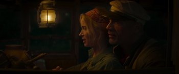 Movie still from “Jungle Cruise” (2021), directed by Jaume Collet-Serra – A man and a woman sitting next to each other; Close Up shot, Low angle