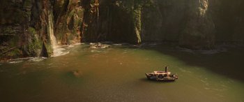 Movie still from “Jungle Cruise” (2021), directed by Jaume Collet-Serra – A man in a boat in the middle of a river; Extreme Wide shot, High angle