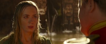 Movie still from “Jungle Cruise” (2021), directed by Jaume Collet-Serra – A beautiful young lady standing in front of a fountain; Close Up shot, Over the shoulder angle