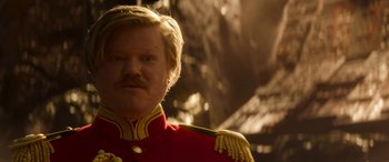 Movie still from “Jungle Cruise” (2021), directed by Jaume Collet-Serra – A person wearing a red and gold uniform; Close Up shot, Low angle