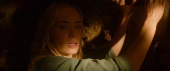 Movie still from “Jungle Cruise” (2021), directed by Jaume Collet-Serra – A woman's face in a cave; Close Up shot, Low angle