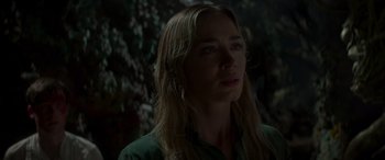 Movie still from “Jungle Cruise” (2021), directed by Jaume Collet-Serra – A person with long blonde hair; Close Up shot, Over the shoulder angle