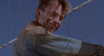 Movie still from “Jurassic Park” (1993), directed by Steven Spielberg – A person smiling; Close Up shot, Low angle