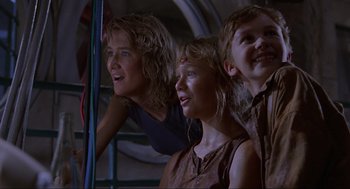 Movie still from “Jurassic Park” (1993), directed by Steven Spielberg – A group of people standing next to each other on a bus; Medium shot, Low angle
