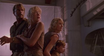 Movie still from “Jurassic Park” (1993), directed by Steven Spielberg – A group of young people standing next to each other; Medium shot, Low angle