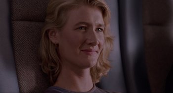 Movie still from “Jurassic Park” (1993), directed by Steven Spielberg – A person with blonde hair; Close Up shot, Over the shoulder angle