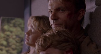 Movie still from “Jurassic Park” (1993), directed by Steven Spielberg – A man and a woman's face; Close Up shot, Low angle