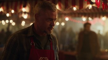 Movie still from “Euphoria” (2019), created by Sam Levinson – A man wearing an apron standing next to lights; Close Up shot, Over the shoulder angle
