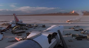 Movie still from “Jurassic Park III” (2001), directed by Joe Johnston – An airplane sitting on top of an airport runway; Extreme Wide shot, Low angle