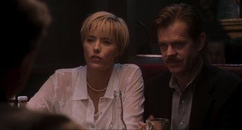 Movie still from “Jurassic Park III” (2001), directed by Joe Johnston – A man and a woman sitting next to each other at a table; Close Up shot, Over the shoulder angle