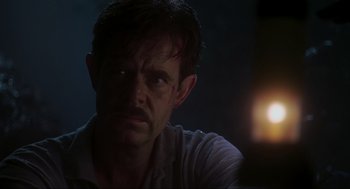 Movie still from “Jurassic Park III” (2001), directed by Joe Johnston – A person looking at the camera; Close Up shot, Low angle
