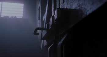 Movie still from “Jurassic Park III” (2001), directed by Joe Johnston – View of a dark room with the light from the window; Extreme Close Up shot, Low angle