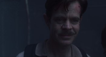 Movie still from “Jurassic Park III” (2001), directed by Joe Johnston – A person with a bandage on his head; Close Up shot, Over the shoulder angle