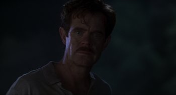 Movie still from “Jurassic Park III” (2001), directed by Joe Johnston – A person wearing a shirt; Close Up shot, Low angle