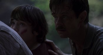Movie still from “Jurassic Park III” (2001), directed by Joe Johnston – A man and a boy are looking into the distance; Close Up shot, Over the shoulder angle