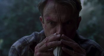 Movie still from “Jurassic Park III” (2001), directed by Joe Johnston – A person eating food; Close Up shot, Low angle