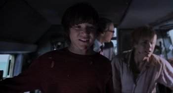 Movie still from “Jurassic Park III” (2001), directed by Joe Johnston – A young boy with a bunch of food on his face; Medium shot, Low angle