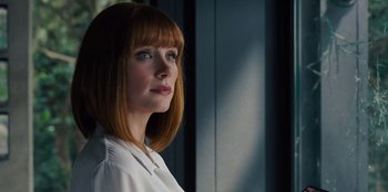 Movie still from “Jurassic World” (2015), directed by Colin Trevorrow – A woman with red hair is looking to her left; Close Up shot, Low angle