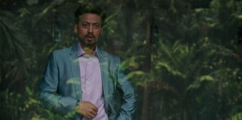 Movie still from “Jurassic World” (2015), directed by Colin Trevorrow – A person wearing a suit and tie; Close Up shot, Low angle