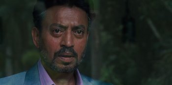 Movie still from “Jurassic World” (2015), directed by Colin Trevorrow – A person wearing a shirt; Close Up shot, Over the shoulder angle