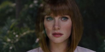 Movie still from “Jurassic World” (2015), directed by Colin Trevorrow – A person wearing a white shirt; Close Up shot, Over the shoulder angle