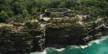 Movie still from “Jurassic World” (2015), directed by Colin Trevorrow – An aerial view of an island in the middle of the ocean; Extreme Wide shot, High angle