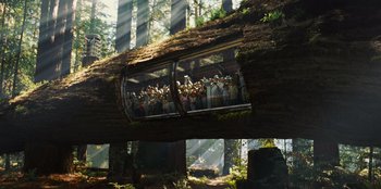 Movie still from “Jurassic World” (2015), directed by Colin Trevorrow – A group of people standing on top of a tree; Extreme Wide shot, Low angle