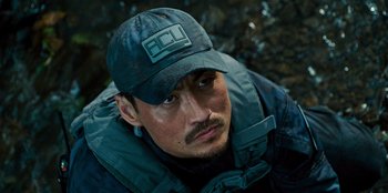 Movie still from “Jurassic World” (2015), directed by Colin Trevorrow – A person wearing a hat; Close Up shot, High angle