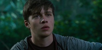 Movie still from “Jurassic World” (2015), directed by Colin Trevorrow – A young man looking up into the sky; Close Up shot, Low angle