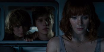 Movie still from “Jurassic World” (2015), directed by Colin Trevorrow – A woman sitting next to a man on a train; Close Up shot, Over the shoulder angle
