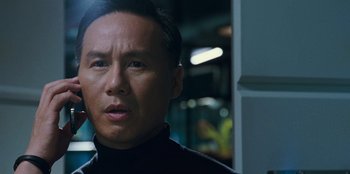 Movie still from “Jurassic World” (2015), directed by Colin Trevorrow – A person wearing a black shirt; Close Up shot, Low angle