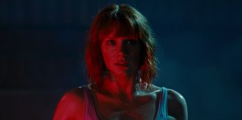 Movie still from “Jurassic World” (2015), directed by Colin Trevorrow – A person wearing a tank top; Close Up shot, Low angle
