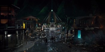 Movie still from “Jurassic World” (2015), directed by Colin Trevorrow – People are standing in the middle of a street; Extreme Wide shot, High angle