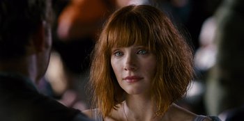 Movie still from “Jurassic World” (2015), directed by Colin Trevorrow – A person with red hair; Close Up shot, Over the shoulder angle
