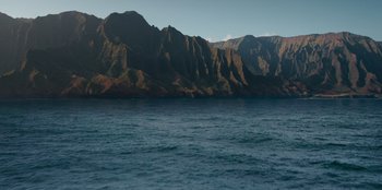 Movie still from “Jurassic World” (2015), directed by Colin Trevorrow – A large body of water with mountains in the background; Extreme Wide shot, High angle
