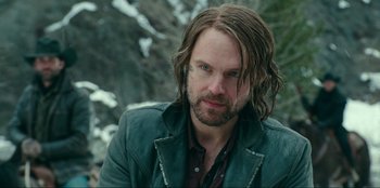 Movie still from “Jurassic World Dominion” (2022), directed by Colin Trevorrow – A person with long hair; Close Up shot, Over the shoulder angle