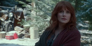 Movie still from “Jurassic World Dominion” (2022), directed by Colin Trevorrow – A woman with long red hair wearing a sweater; Close Up shot, Over the shoulder angle