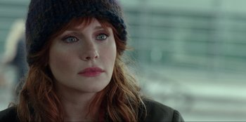 Movie still from “Jurassic World Dominion” (2022), directed by Colin Trevorrow – A person wearing a hat; Close Up shot, Over the shoulder angle