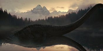 Movie still from “Jurassic World Dominion” (2022), directed by Colin Trevorrow – An animal that is sitting in a body of water; Extreme Wide shot, Low angle